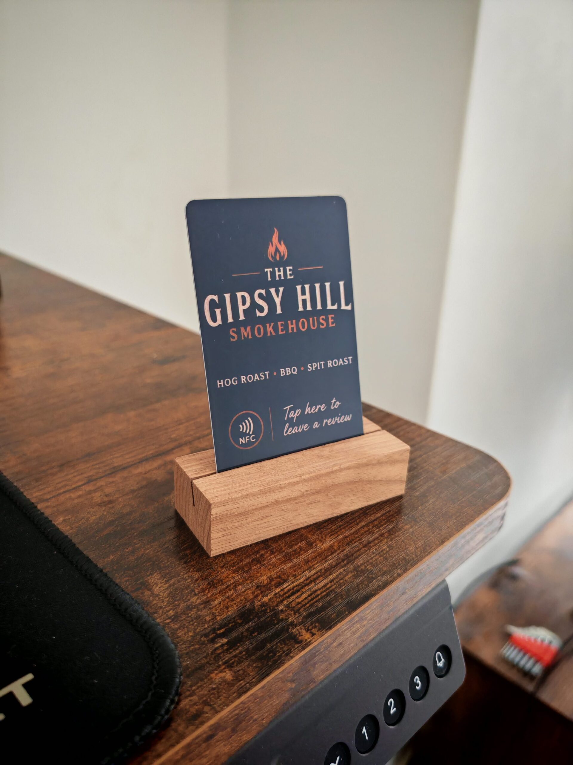 Gipsy Hill Smokehouse branded NFC review card in wooden stand
