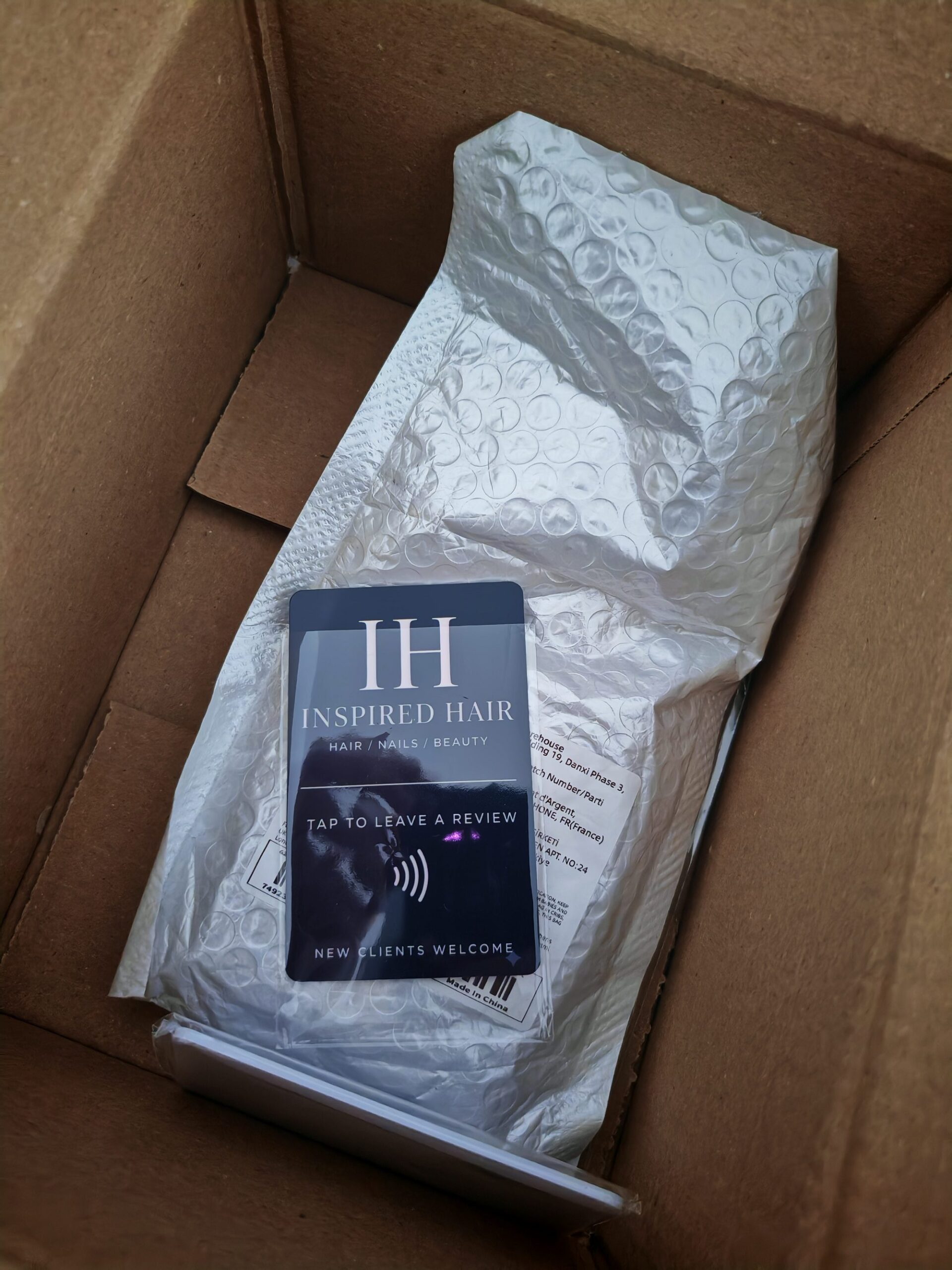 Inspired Hair branded NFC review card in shipping box