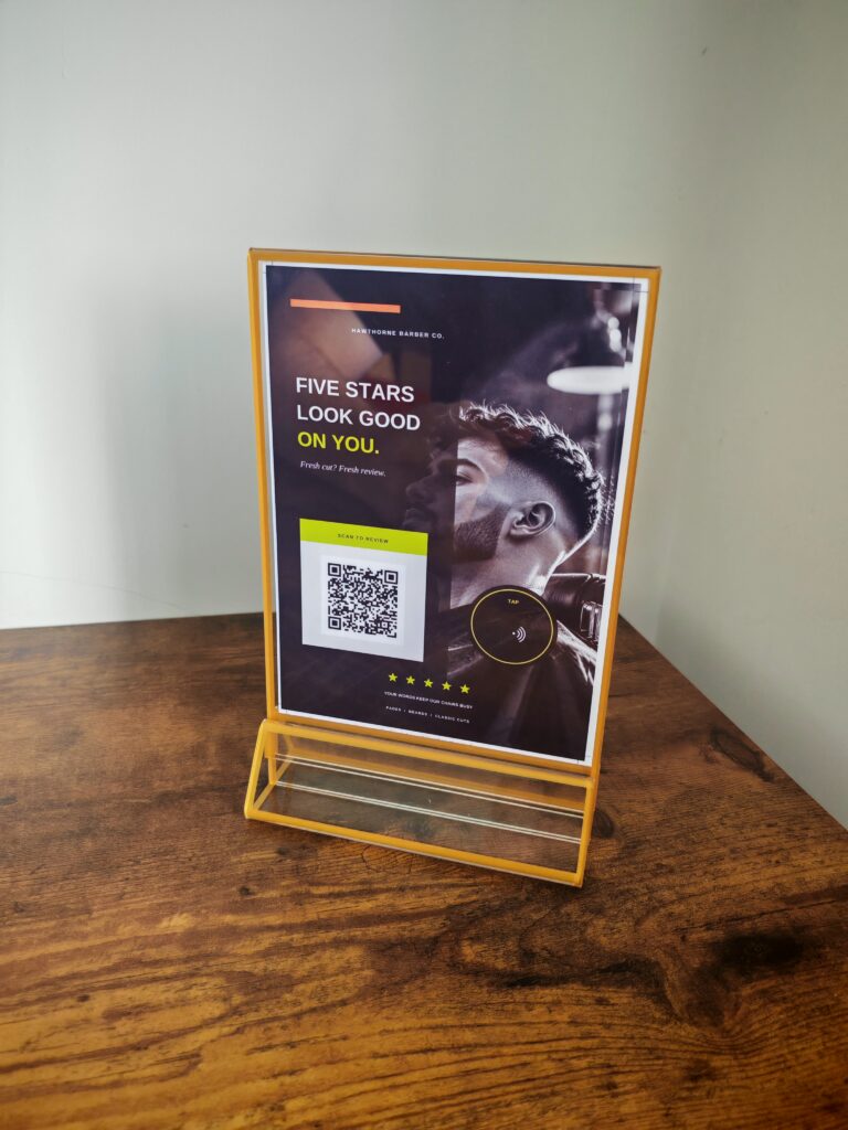 A5 branded NFC and QR Google review stand for a barber